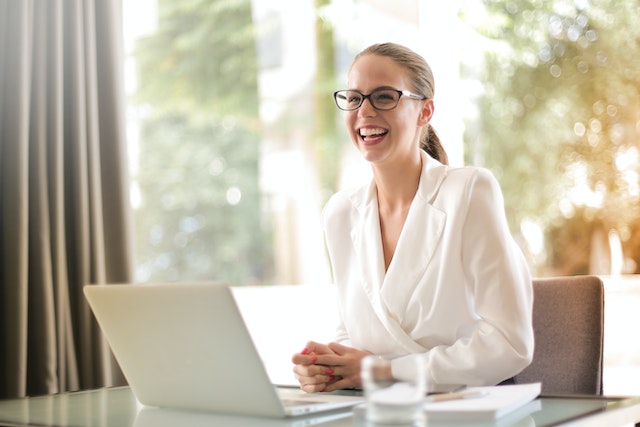 property manager sitting at their desk smiling